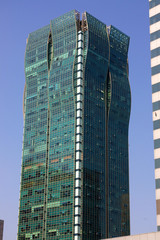 a blue glazed skyscraper in shanghai, china