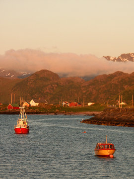 eggum's fjord at midnight with boats