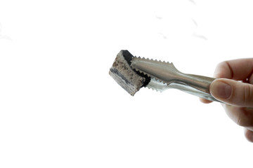 tongs with charcoal