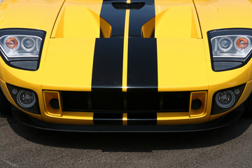 front of yellow supercar with black stripes