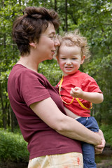 Fototapeta premium mum gently embraces the son