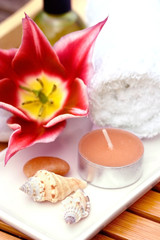 Tulip and towel with candle for spa setting