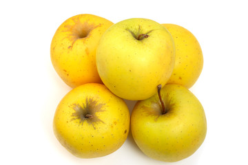 heap of five yellow apples