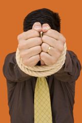 a businessman with her hands tied for a corporate crime