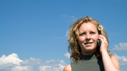 Happy young lady talking on the phone