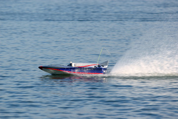 Fototapeta premium speed boat model sail to the left with swirl