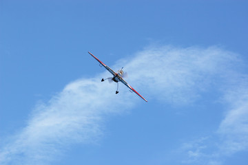 small sport plane flying from camera