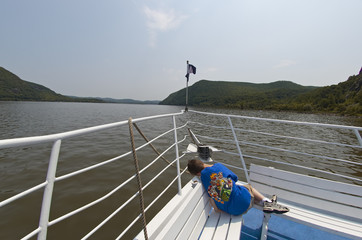 A Boy who fell asleep on a boat on the Hudson River