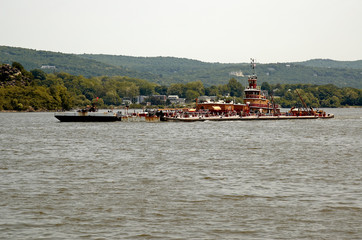 A Tug Boat and a barge on the Hudson River