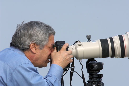 A Photographer in the field shooting Nature