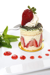 A colorful gourmet strawberry dessert cake on a plate
