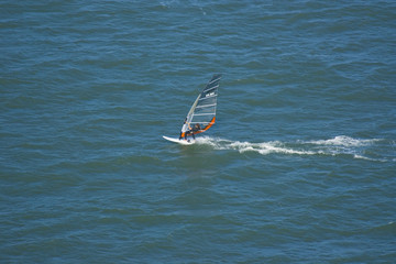 Surfer at the Golden Gate Bridge in San Francisco