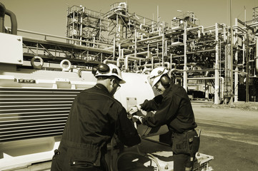 engineers working inside oil-refinery