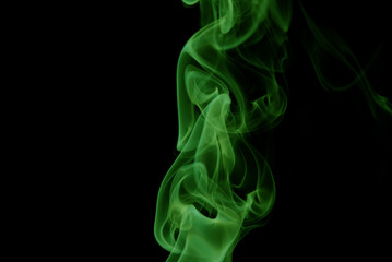Obraz premium Green Smoke abstract on black background .