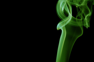 Green Smoke abstract on black background .