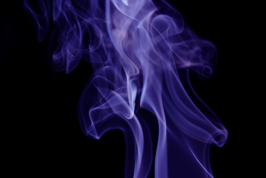 Purple Smoke abstract on black background .