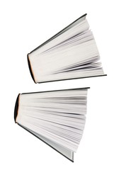 two big books partialy open floating un white background