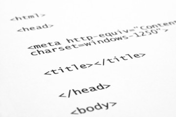 closeup of html code on white paper background