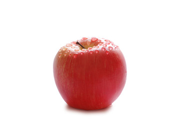 Red apple with water drops isolated on white