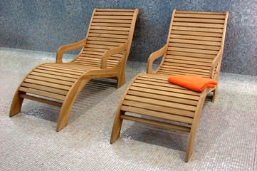 two Sunbeds in the fitness with one orange towel