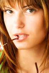 portrait of young woman with eyeglasses on lips