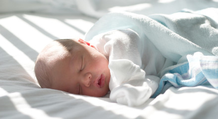 Newborn sleeping in hospital