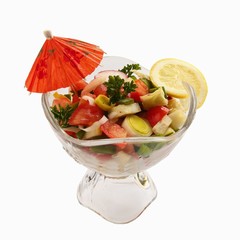 glass dish with vegetables on white background and lemon