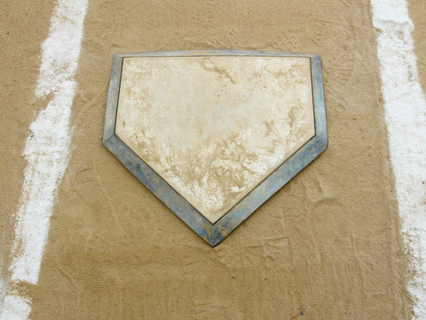 Close-up of home plate on a municipal baseball diamond