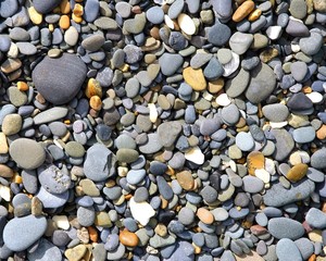 smoothed pebbles on the beach by the ocean