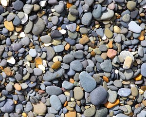 smoothed pebbles on the beach by the ocean