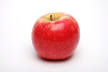 Rosy red apple on white background