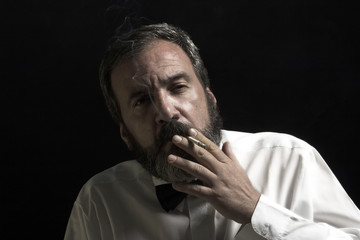 thoughtful gentleman is smoking