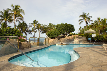Fototapeta na wymiar Tropical Resort Swimming Pool next to Ocean Beach