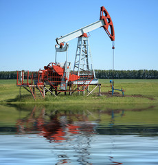 Oil Pump Jack near a sea
