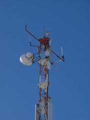 The peak of communication Hi-Tek mast with lights and antennas