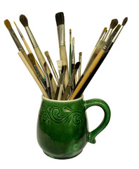 paint brushes in a jug. isolated on white.