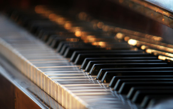 a piano with the open black-and-white keyboard