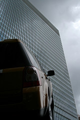 car pointing towards office building