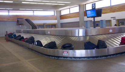 suitcases and bags at the airport luggage carousel © William Casey