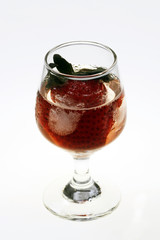 Strawberry in glass and ice