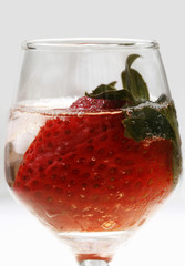 Strawberry in glass and ice