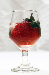 Strawberry in glass and ice