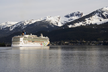 Cruise ship docked in Skagway Alaska with mountains