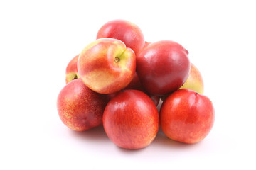 pile of fresh and delicious nectarines isolated on white