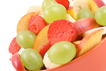 bowl of fruity salad - banana strawberry nectarine and grape