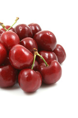 pile of delicious cherries isolated on white