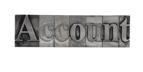 old, inkstained metal type letters form the word 'Account'