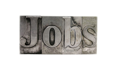 the word 'Jobs' in old, inkstained metal type