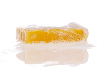 Wet soap bar isolated on white