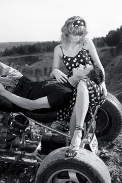 couple having fun outdoors on a motorbike